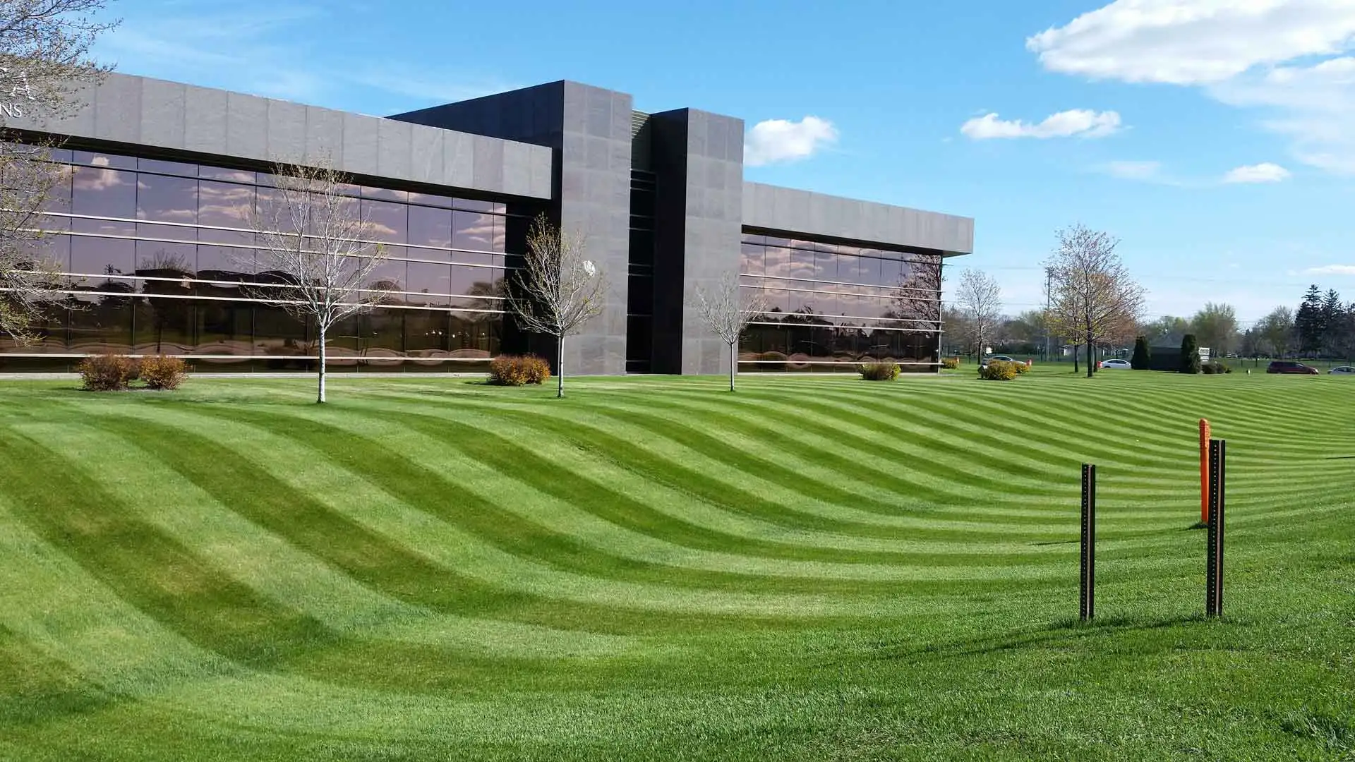 Commercial building in St. Cloud, MN with mowing stripes in lawn.