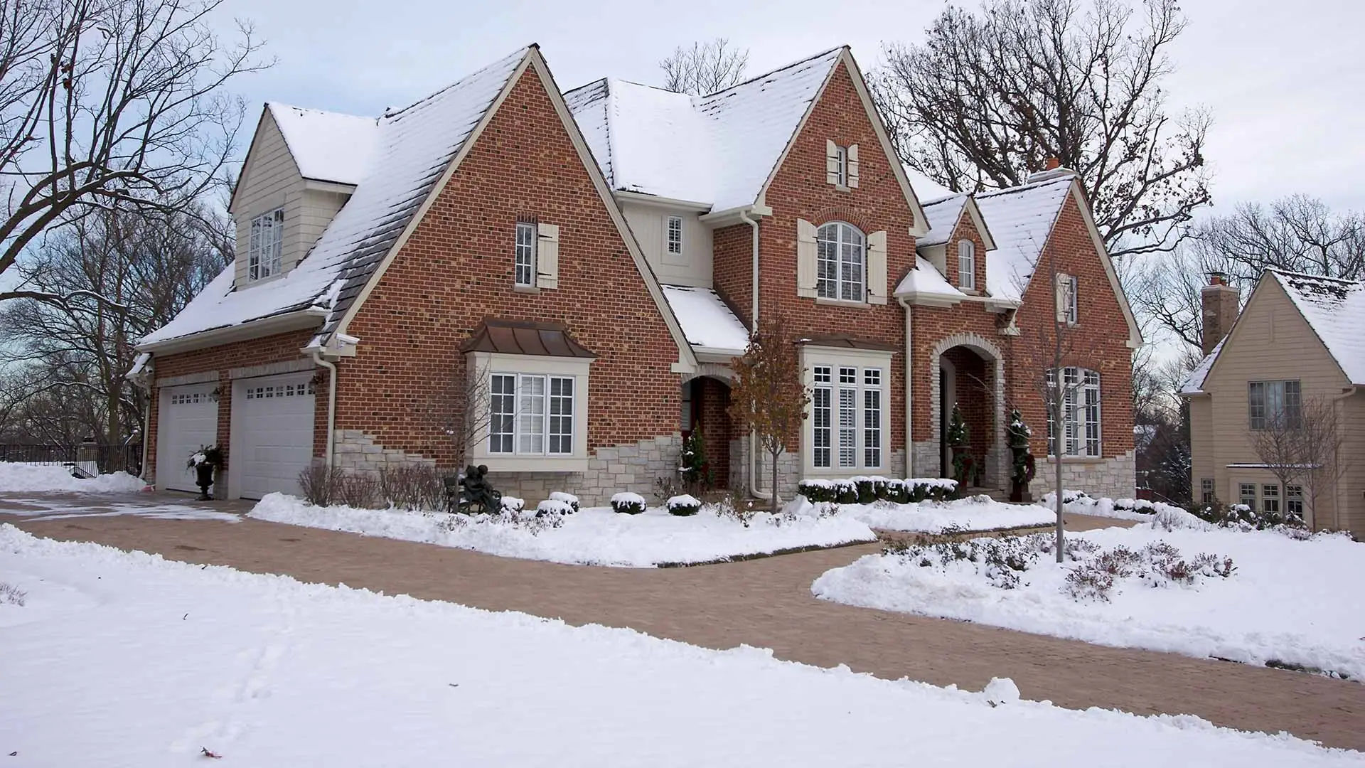 Driveway and sidewalk that has been plowed, snow removed, and de-iced in St. Cloud, MN.