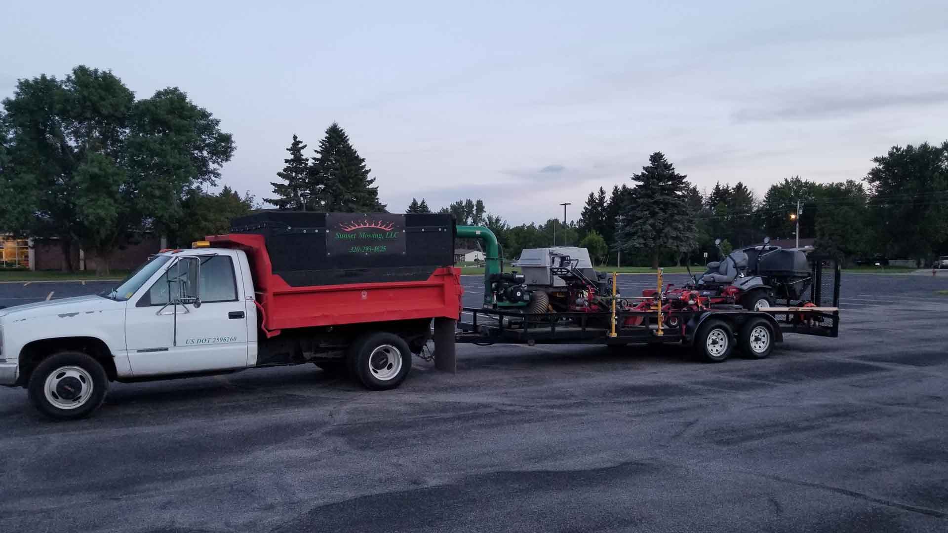 Sunset Mowing truck with equipment.