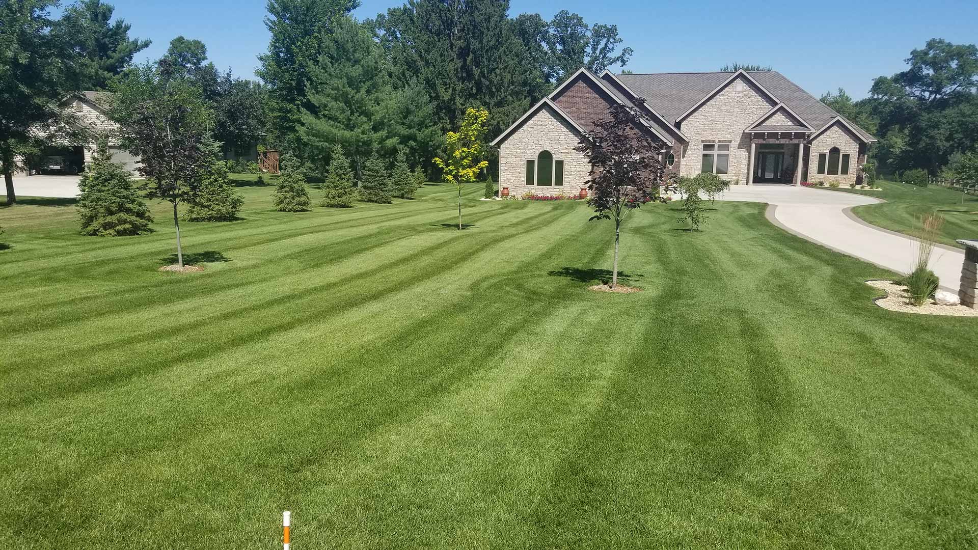 St. Cloud, MN home with regular lawn mowing services.