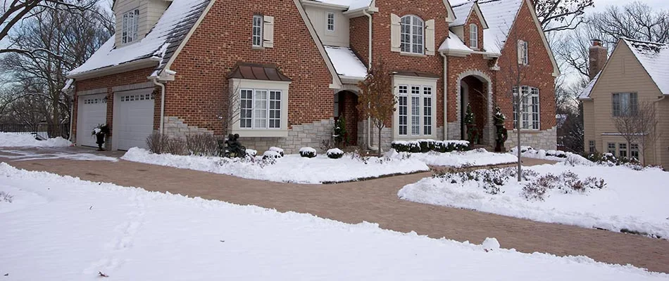Residential property with recent snow removal services in Sartell, MN.