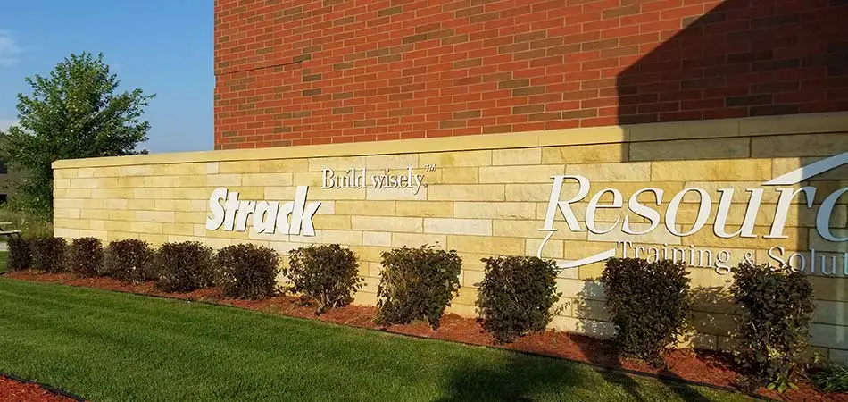 Trimmed bushes at a commercial property in Sartell, MN.