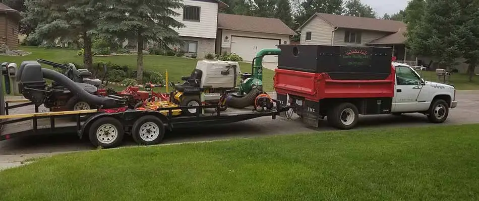 Sunset Mowing company vehicle preparing to mow a lawn in Sartell, MN.