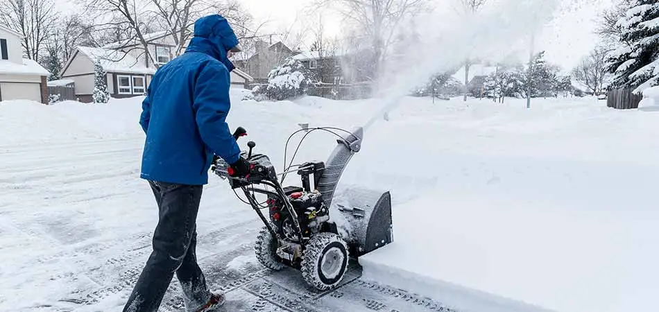 St. Cloud homeowner having the sidewalk in front of his house cleared of snow.