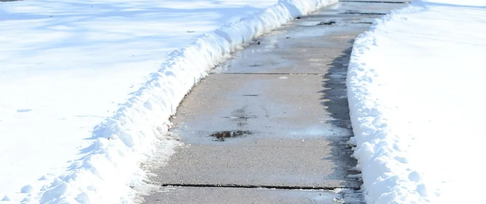 Clearing snow from sidewalks in St. Cloud, MN helps reduce ice-related injuries.