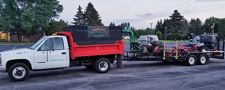 Sunset Mowing truck and maintenance trailer.